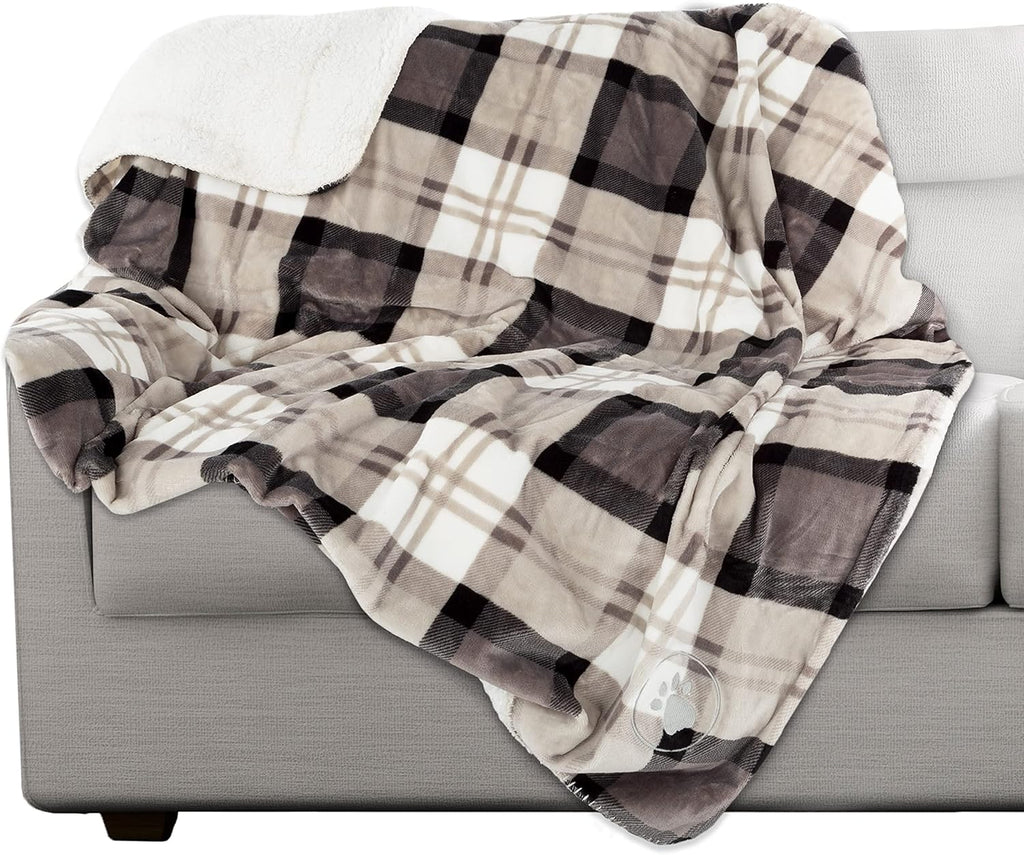 Large dog resting comfortably on the Petmaker water resistant fleece throw in a car seat.