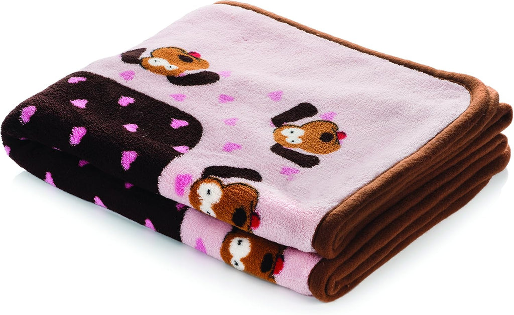 Snuggle Puppie 48 by 30 inches dog blanket spread across a pet bed for extra cushioning