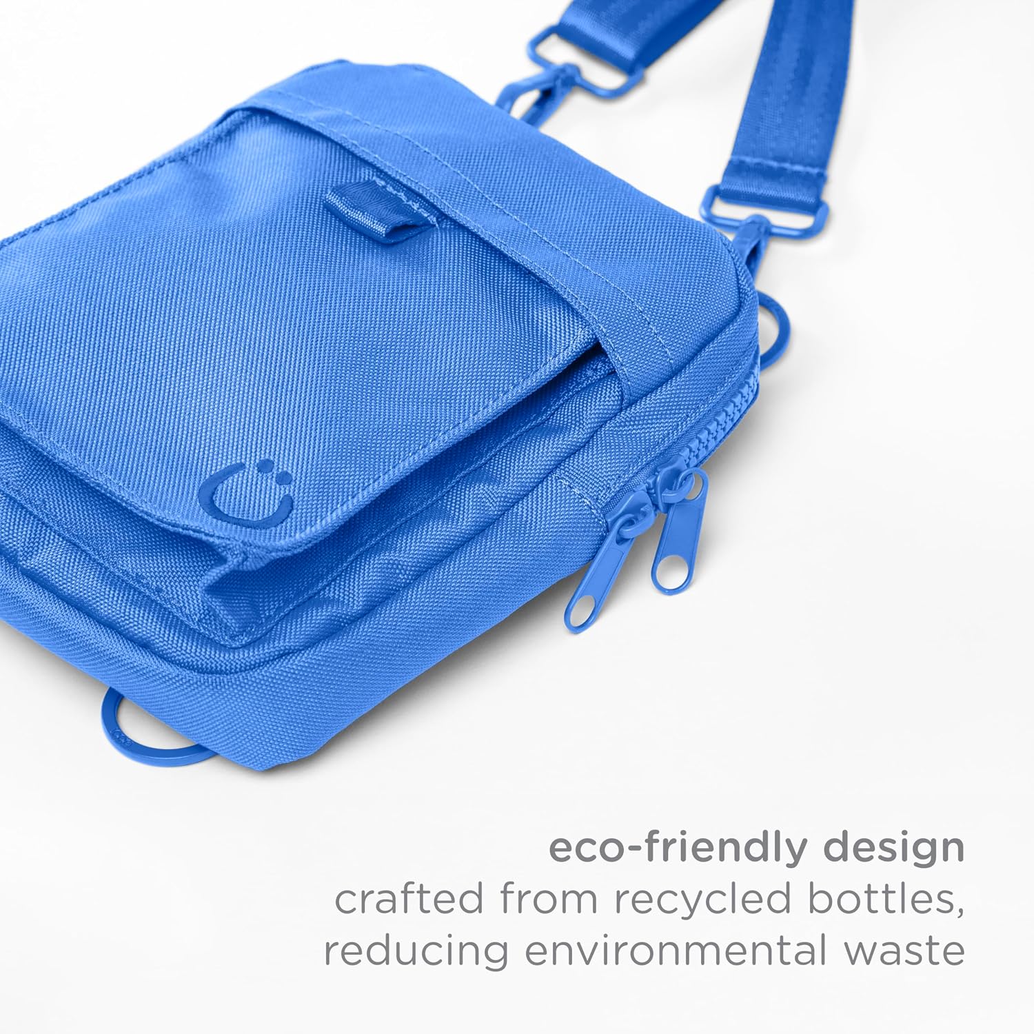 Ubbi recycled RPET blue walking bag demonstrating one handed access with the pull tab