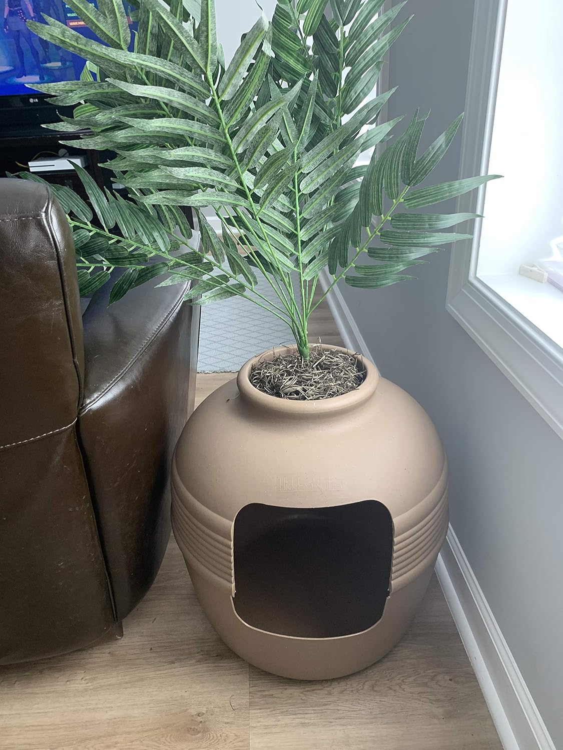 Fresh Headquarters filter pad demonstrated inside hidden plant litter box lid