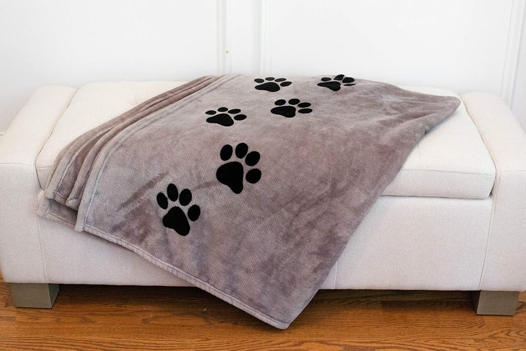 Pawprints Left by You bereavement gift blanket folded neatly showing premium soft material.