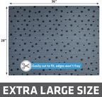 Cat stepping out of a litter tray onto the soft paw friendly Drymate tracking mat.
