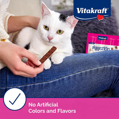 Cat eating Vitakraft PurrSticks meaty chicken treat