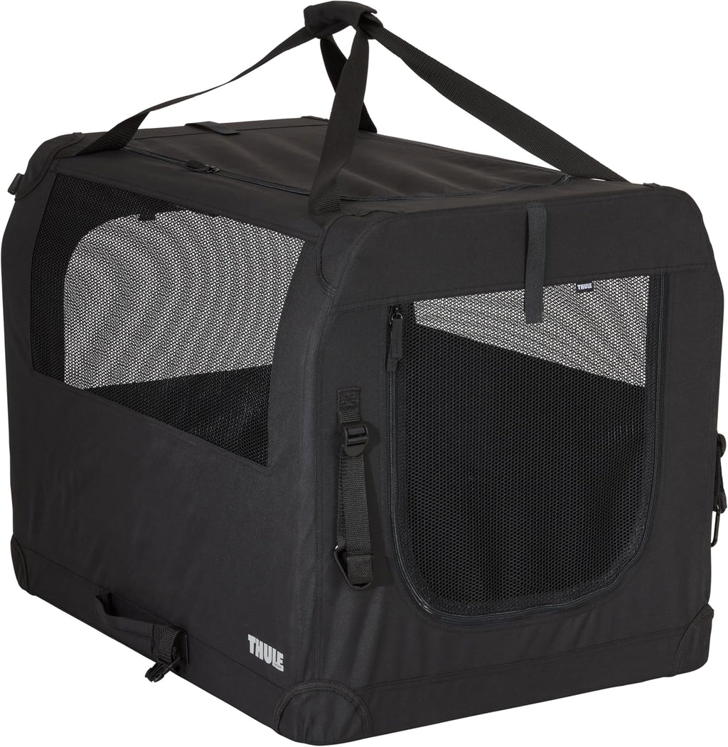 Thule Collapsible Dog Kennel Medium front view showing secure black fabric and mesh door setup.