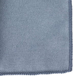 Microfiber towel wiping down a leather horse saddle