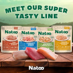 Cat eating kibble topped with Natoo salmon broth