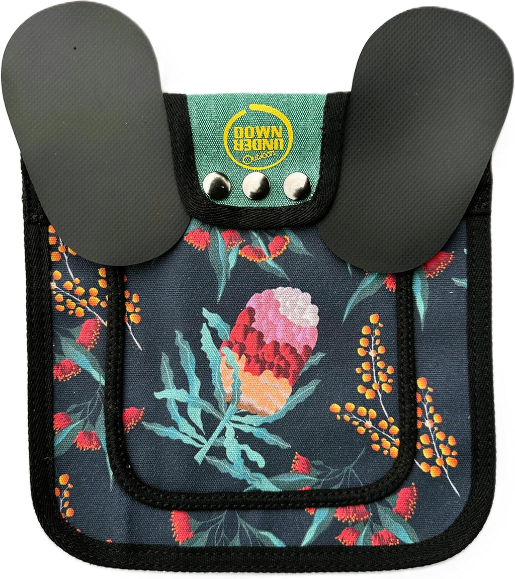 Side view of hen wearing a floral patterned poultry protector apron
