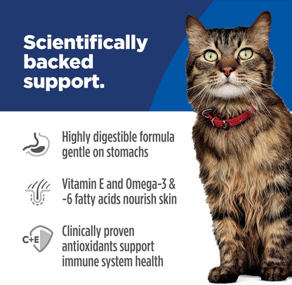 Healthy adult cat eating Hill's Science Diet dry food