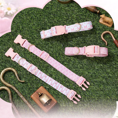 Side view of the patterned pink nylon tracking collar highlighting the fade-resistant fabric texture.