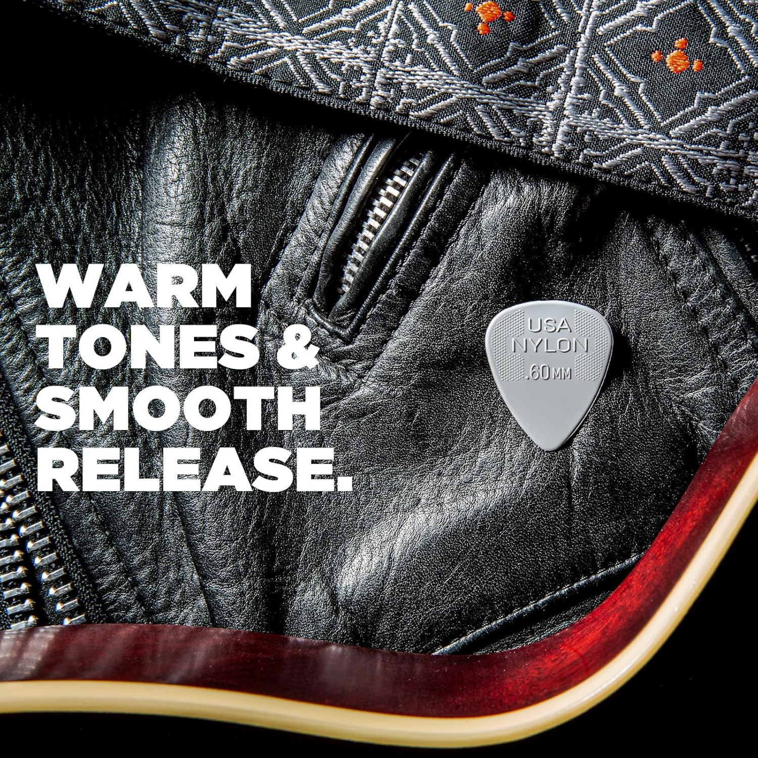 Twelve pack of Jim Dunlop 0.38mm nylon standard guitar picks arranged neatly on a flat surface.