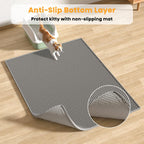 Someone opening the EZ open edge of the Pieviev gray mat to dump trapped litter back into the tray.