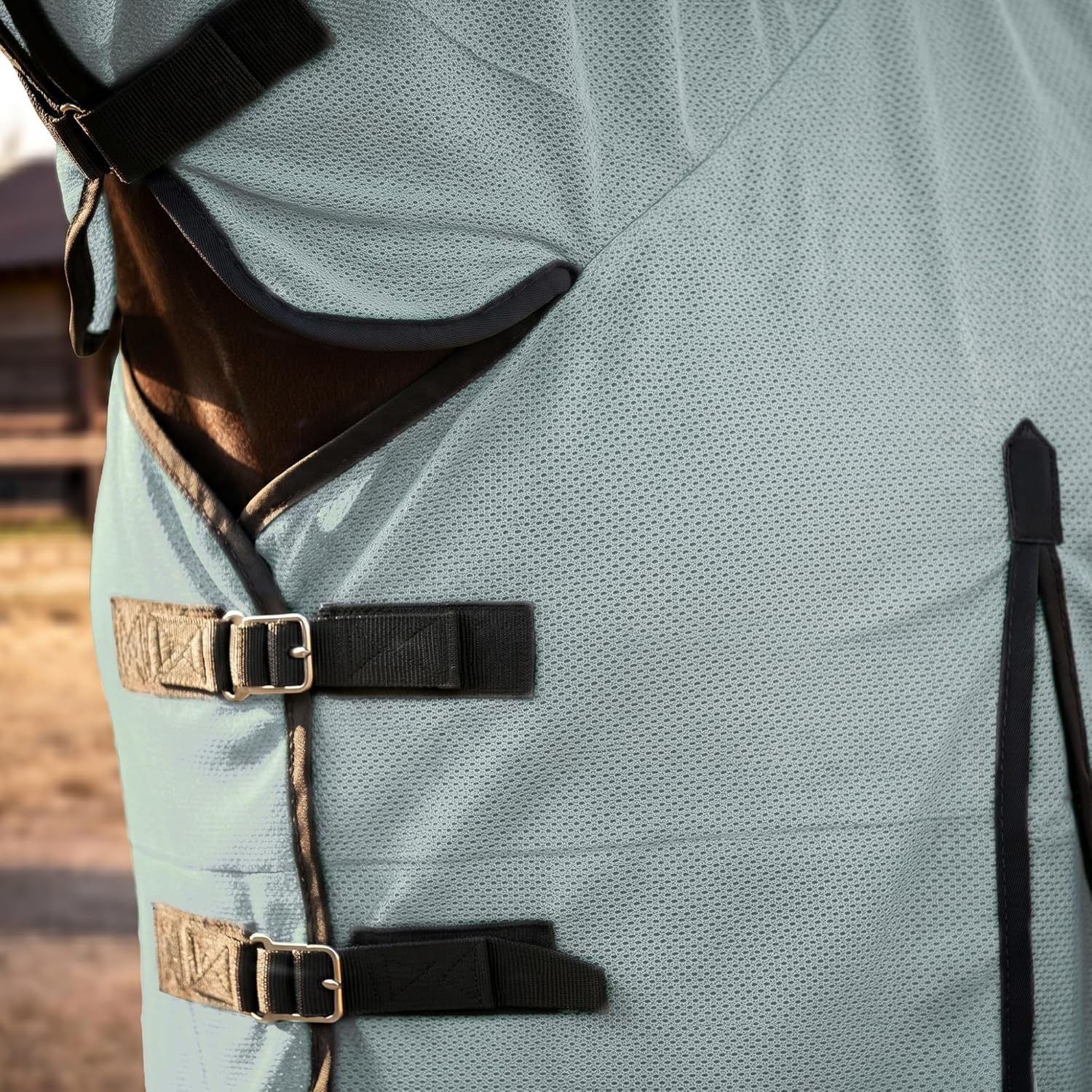 Close up of adjustable belly wrap buckles on breathable mesh sheet