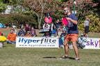 Pink Hyperflite dog disc on grass for visibility check
