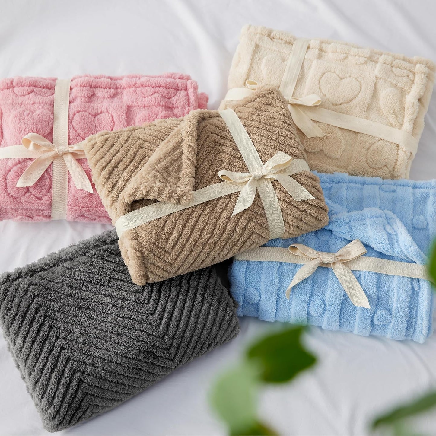Bedsure fluffy pet throw being placed into a washing machine for cleaning.