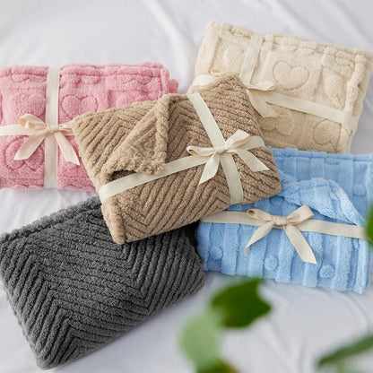 Bedsure fluffy pet throw being placed into a washing machine for cleaning.