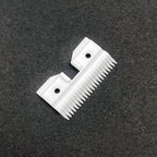 White ceramic pet clipper replacement blade parts on a clean backdrop