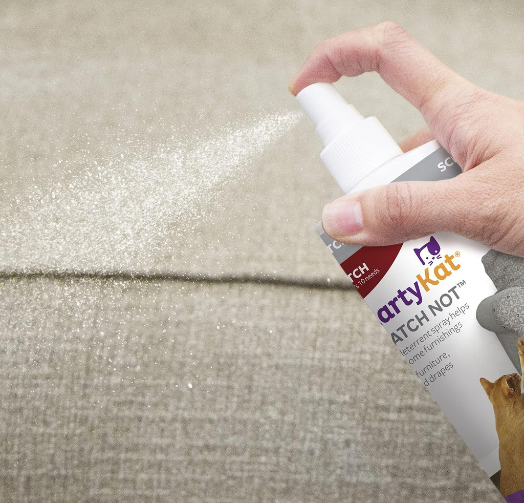 SmartyKat scratch deterrent spray being used near furniture