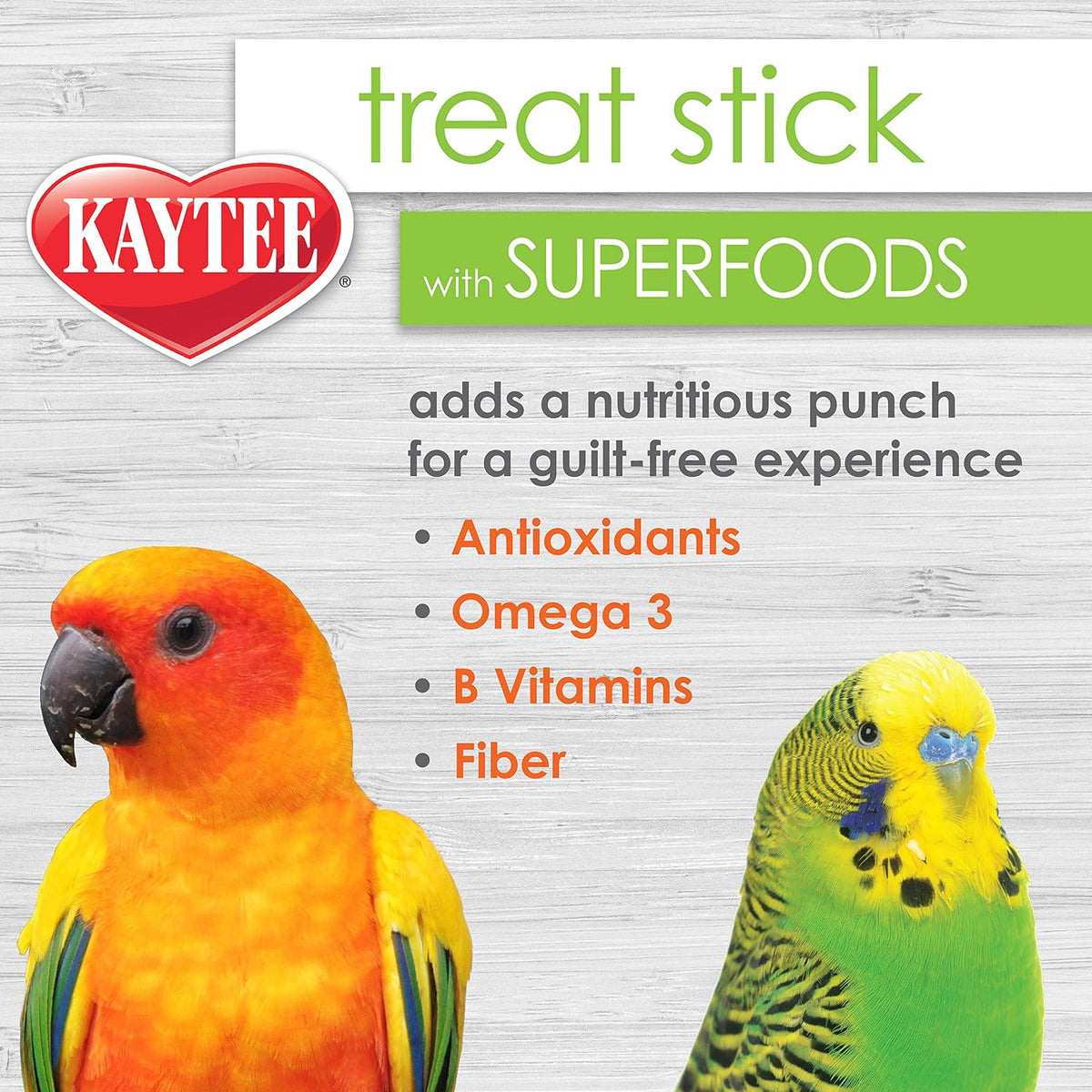 Small bird eating Kaytee superfood treat stick in cage