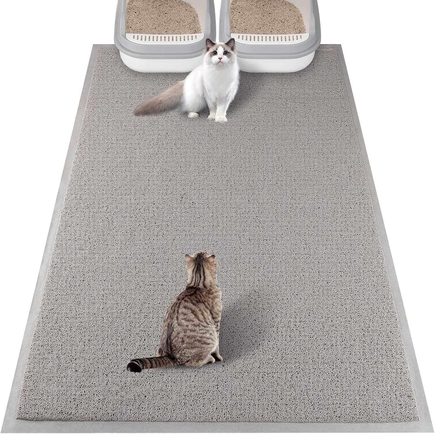 A domestic cat comfortably walking across the protective gray floor mat.