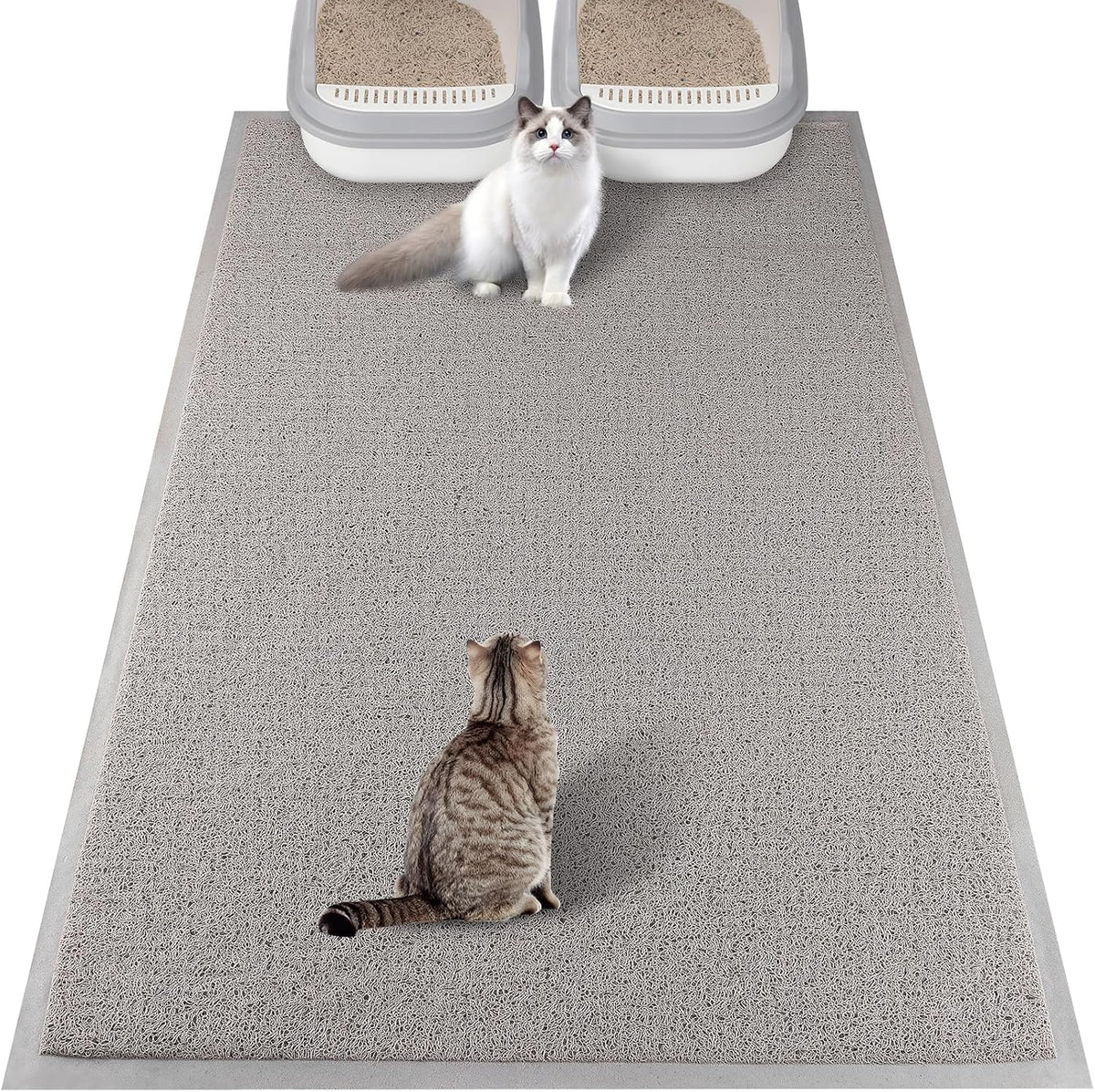 A domestic cat comfortably walking across the protective gray floor mat.