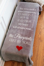 Close-up texture of the 300 GSM heavyweight polyester fleece on the Pawprints Left by You memorial blanket.