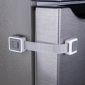 HomeBrella Child Proof Fridge Lock front view showing the dual-button latch on a white refrigerator door.