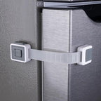HomeBrella Child Proof Fridge Lock front view showing the dual-button latch on a white refrigerator door.