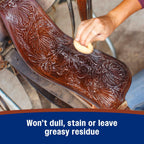 Applying leather cleaner spray to equestrian bridle