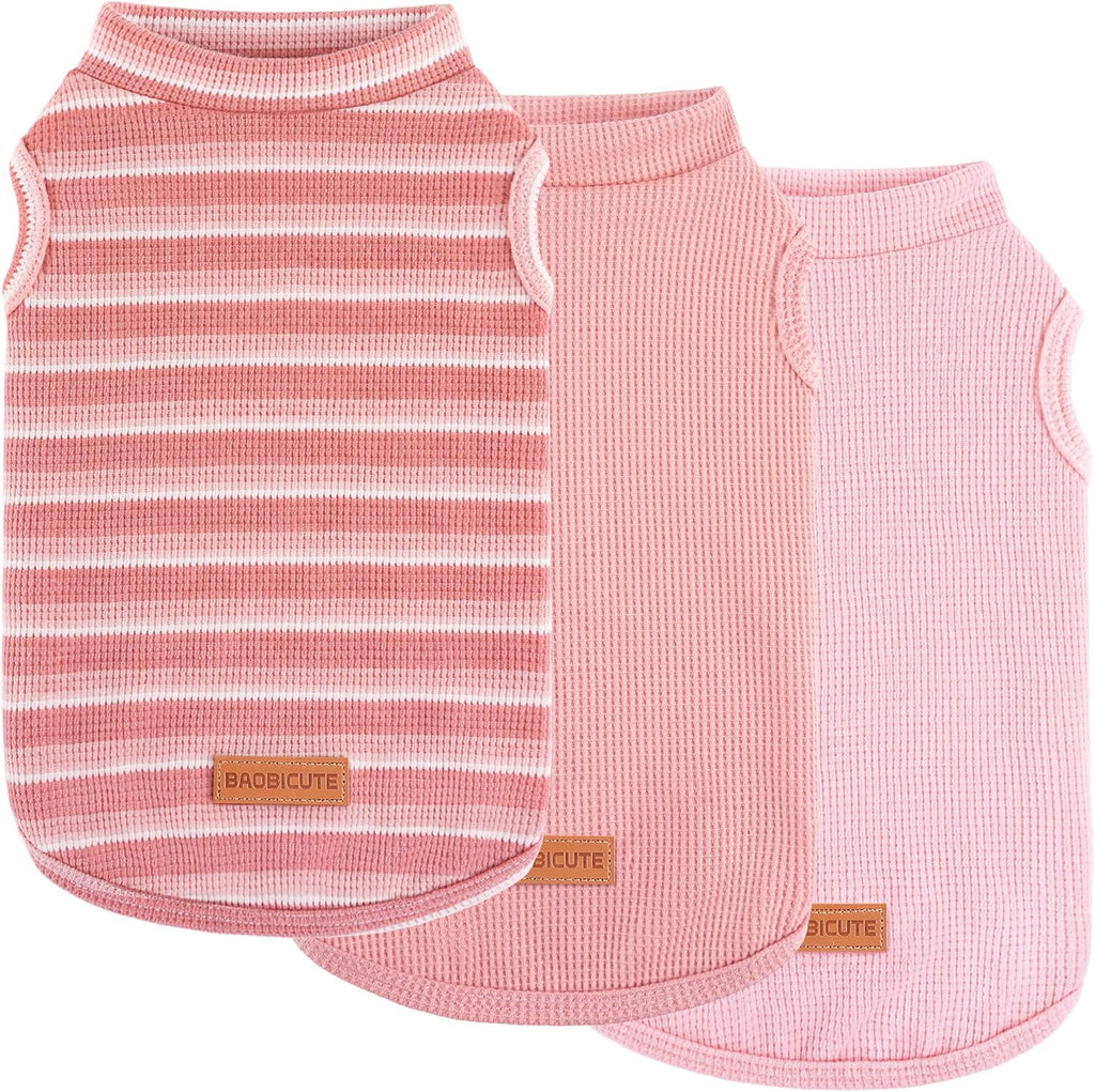 Dog lounging indoors in cozy waffle vest