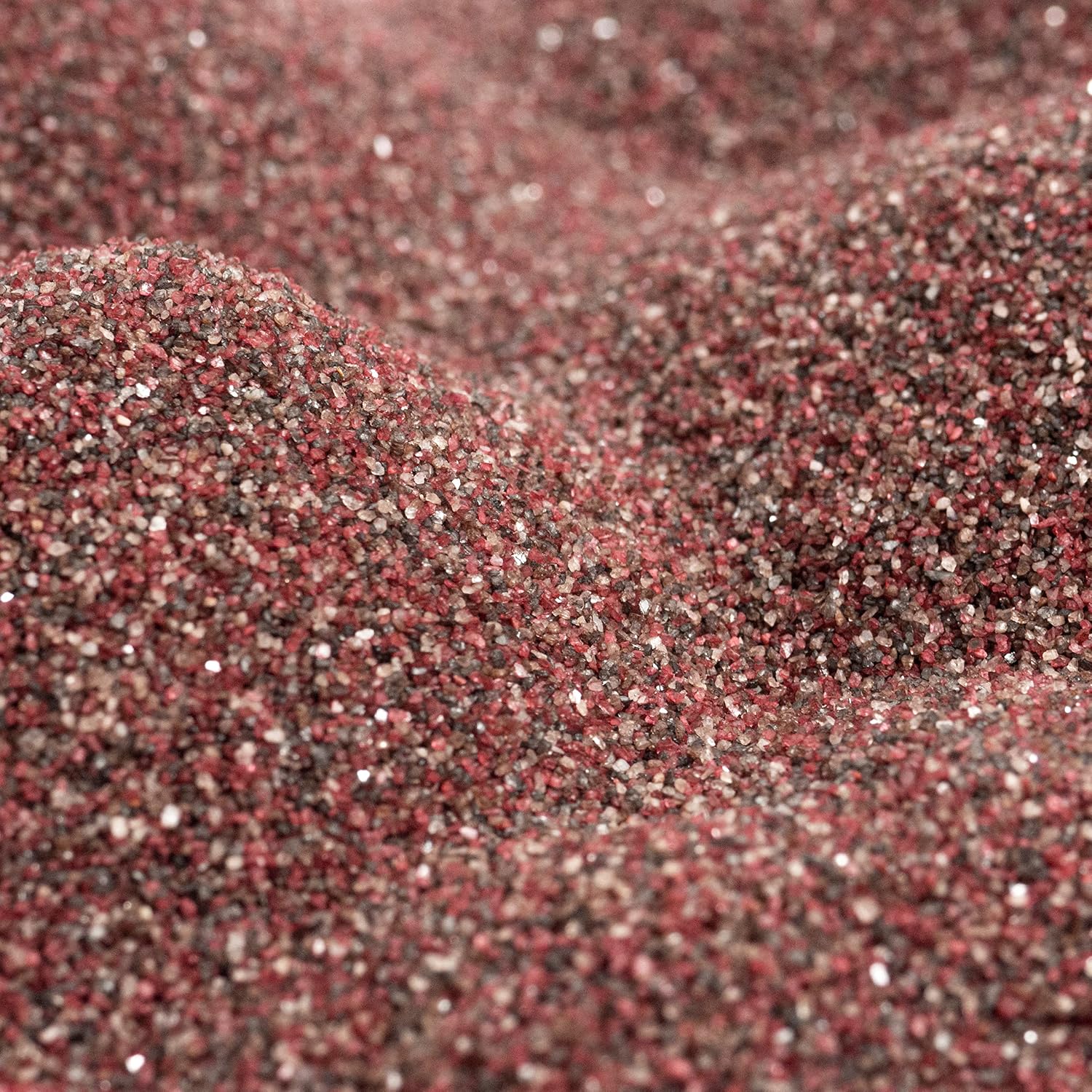 Close up texture of Sandtastik brick colored coarse sand