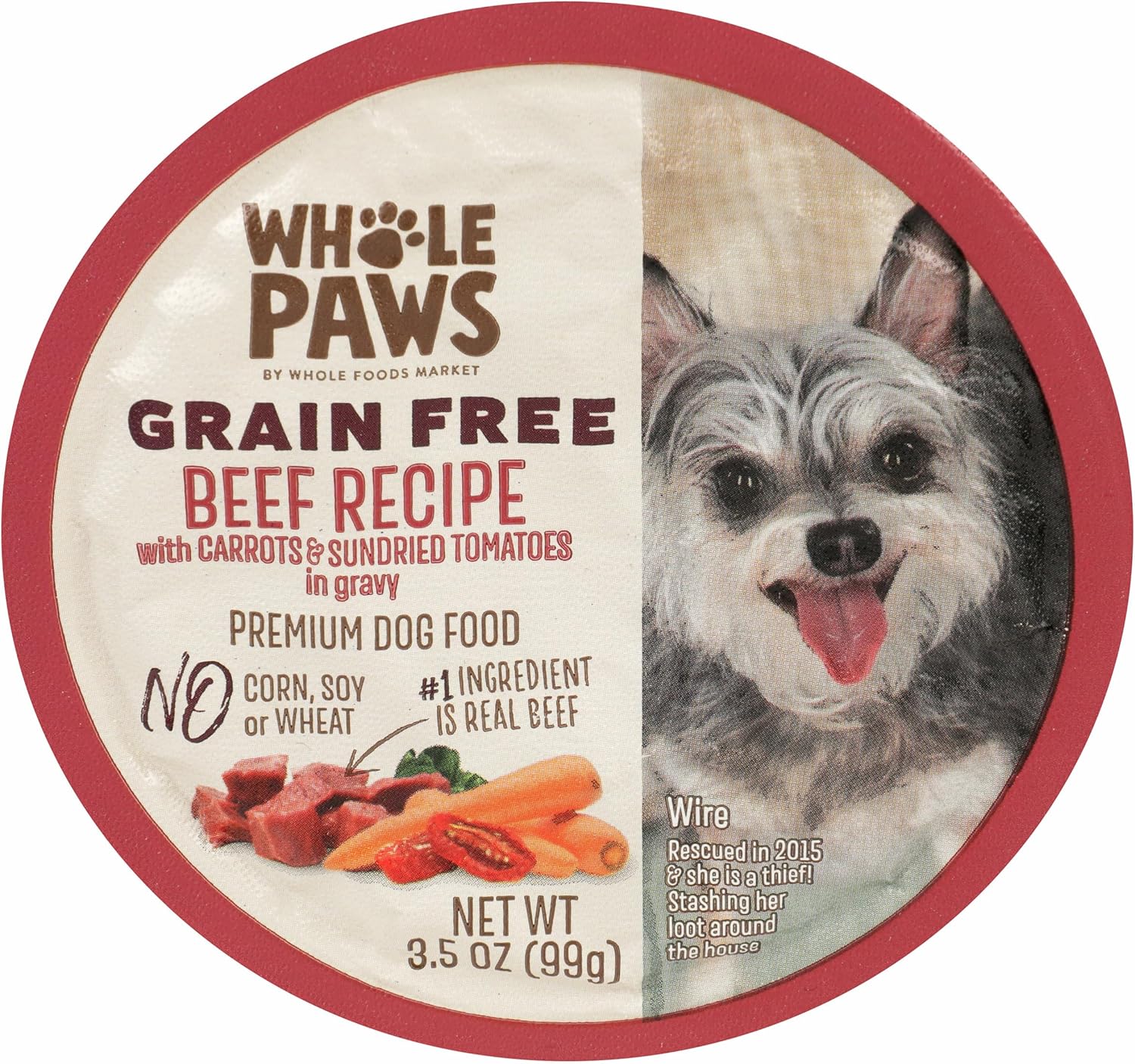 Whole Paws wet dog food 3.5 Ounce container in hand for scale