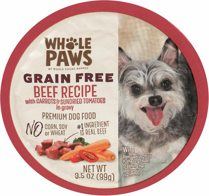 Whole Paws wet dog food 3.5 Ounce container in hand for scale