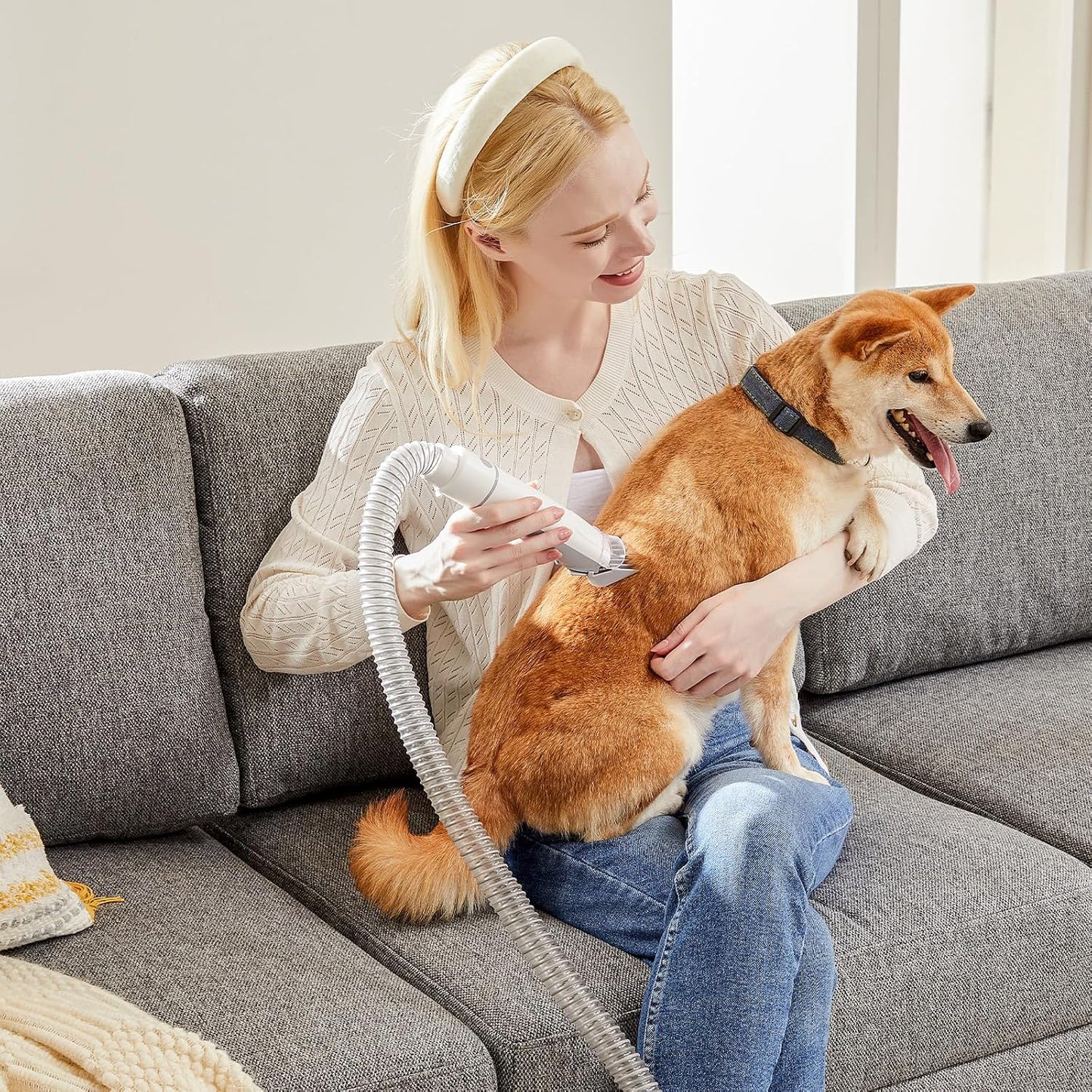 Sweetcrispy quiet pet hair vacuum cleaner removing loose fur from a living room sofa