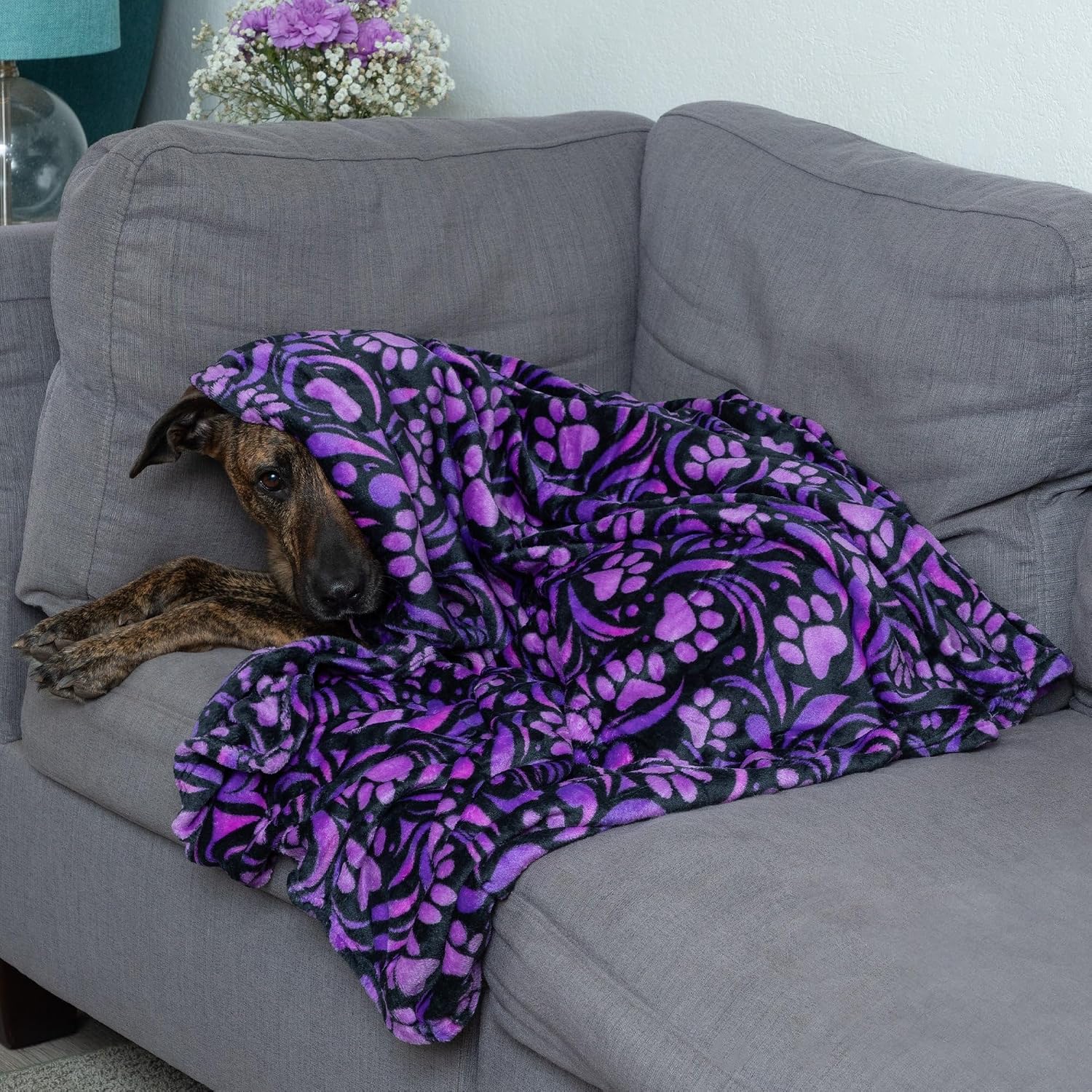 Durable machine washable pet throw blanket inside a travel crate.