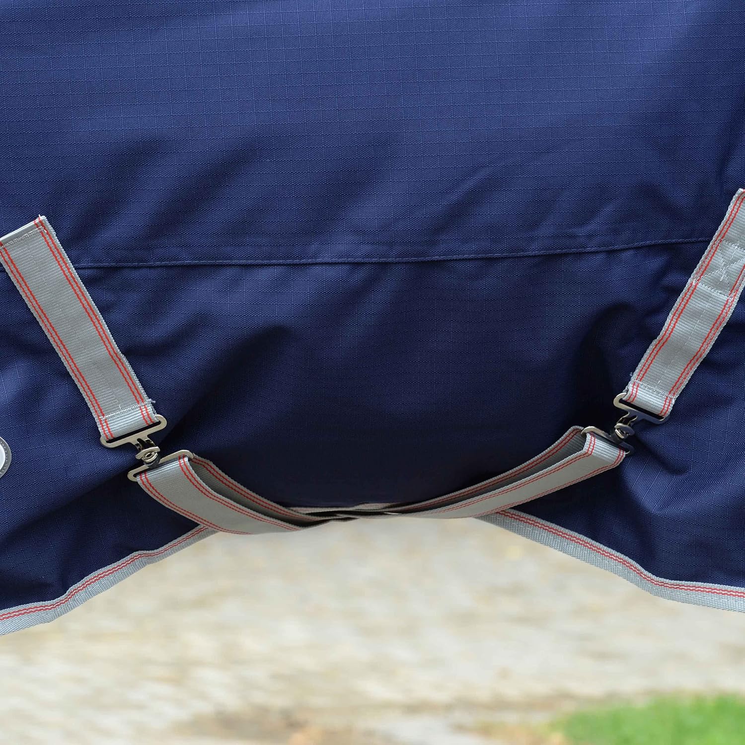 WeatherBeeta medium weight horse blanket showing twin low cross surcingles and adjustable leg straps.