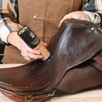 Rhino Wax eight ounce leather oil bottle highlighting non toxic natural ingredient label.