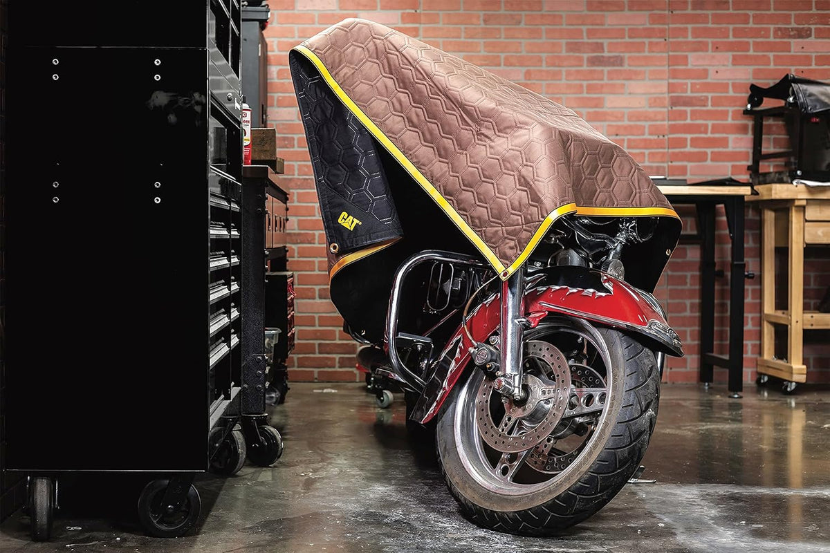 CAT heavy duty padded blanket spread out showing the 72 by 60 inch dimensions.