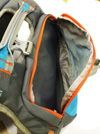 Side angle of the Cesar Millan dog saddlebag showing the spacious storage compartments and weatherproof nylon material.
