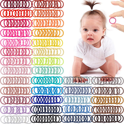 CÃ‰LLOT baby hair ties front view showcasing thirty-six distinct vibrant colors of elastic bands arranged neatly.