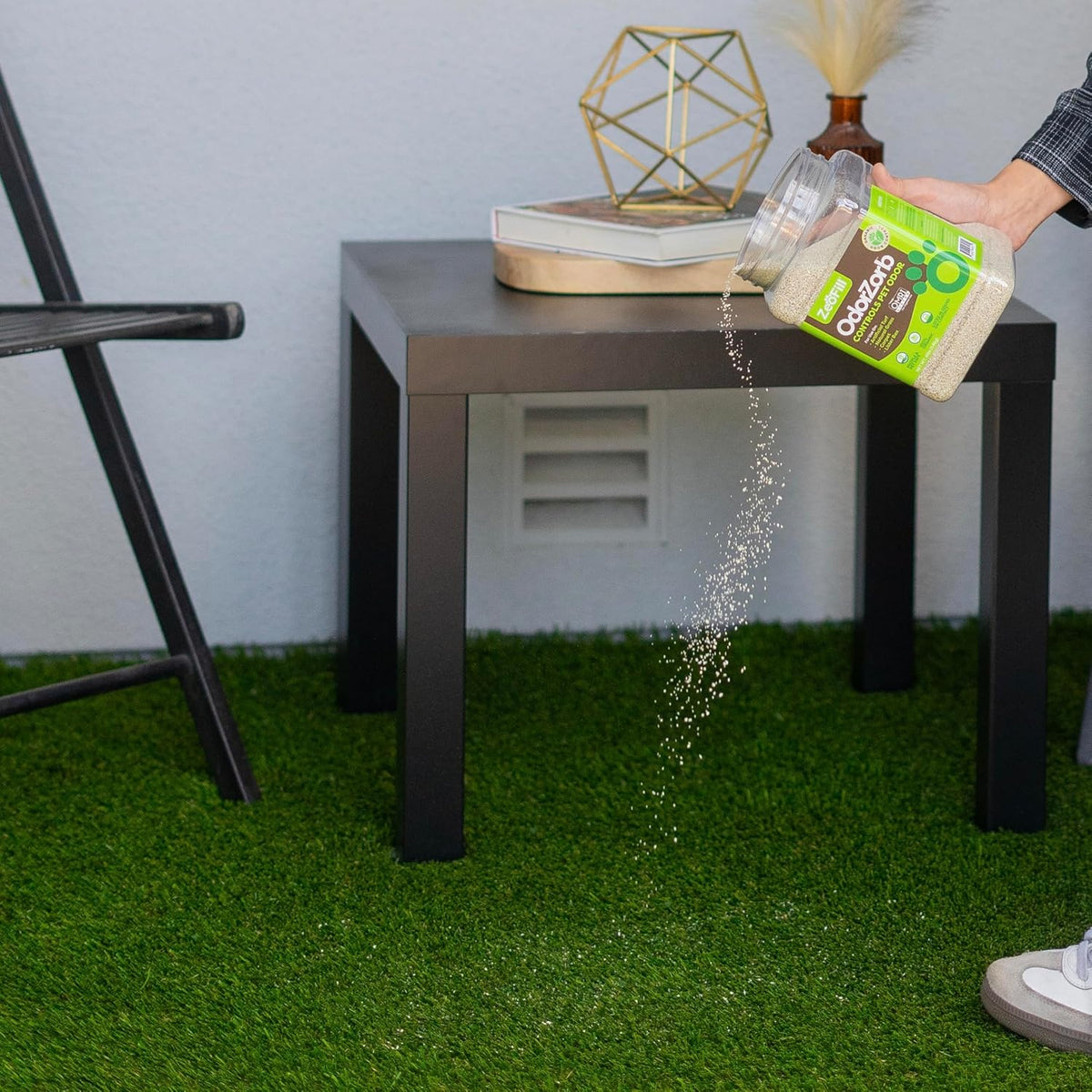 Applying zeolite granules on lawn for odor removal