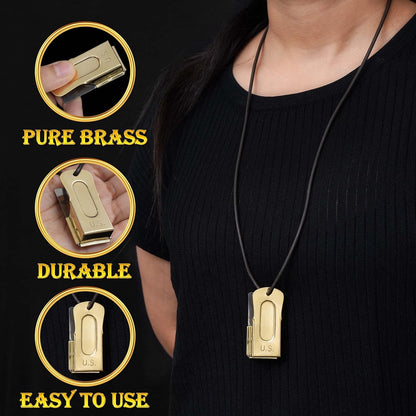 Heavy duty brass puppy cricket clicker with attached black lanyard strap.