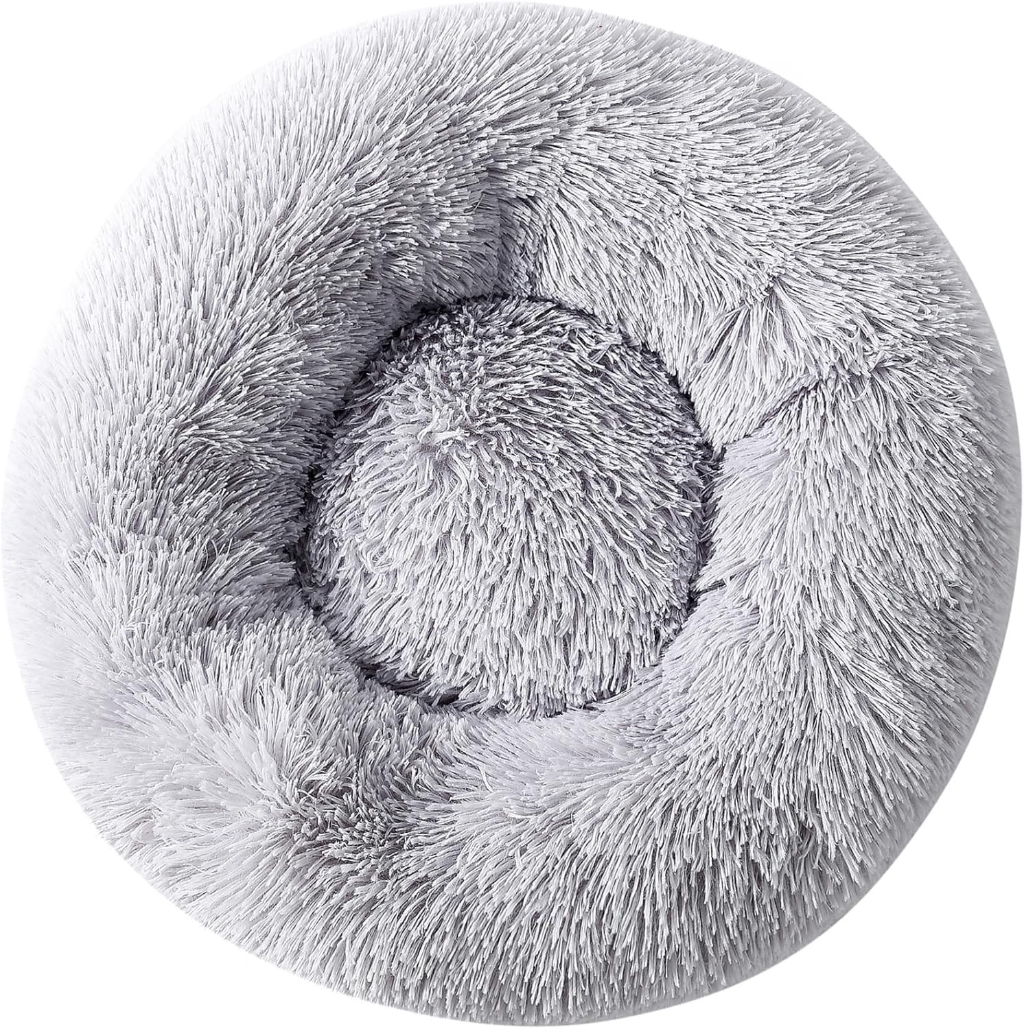 Top down view of small dog resting in circular donut bed