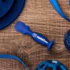 Squishface bulldog wrinkle paste applicator standing upright on its built-in suction cup base