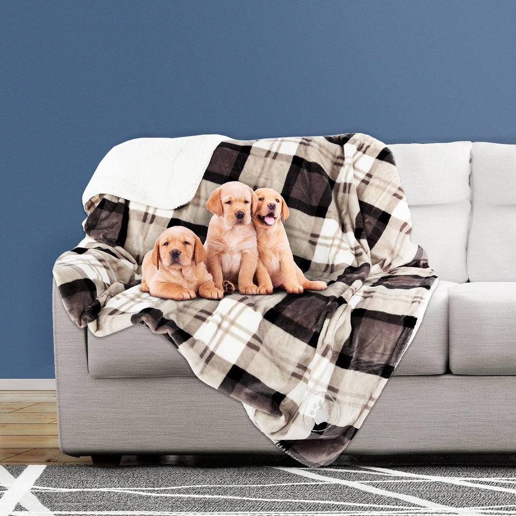 Petmaker gray plaid pet throw blanket folded neatly on a bed.