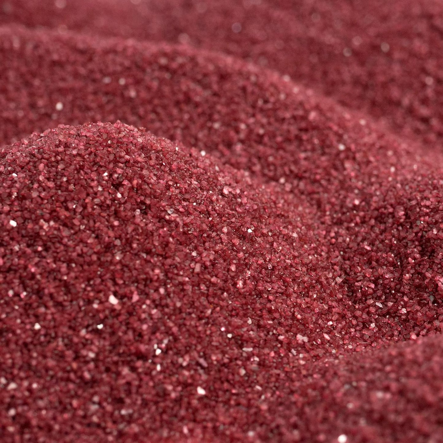 Close up texture of Sandtastik dark red coarse grains