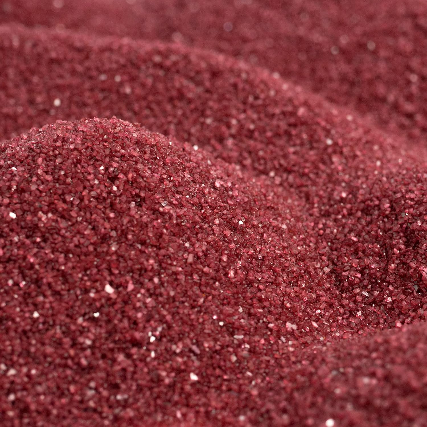 Close up texture of Sandtastik dark red coarse grains