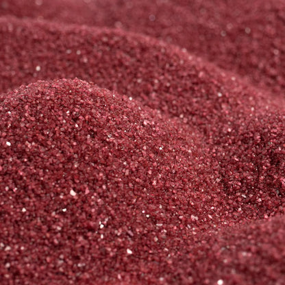 Close up texture of Sandtastik dark red coarse grains