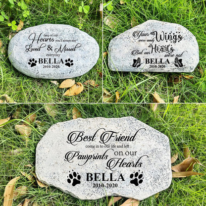 Cat memorial stone placed on a green lawn outdoor