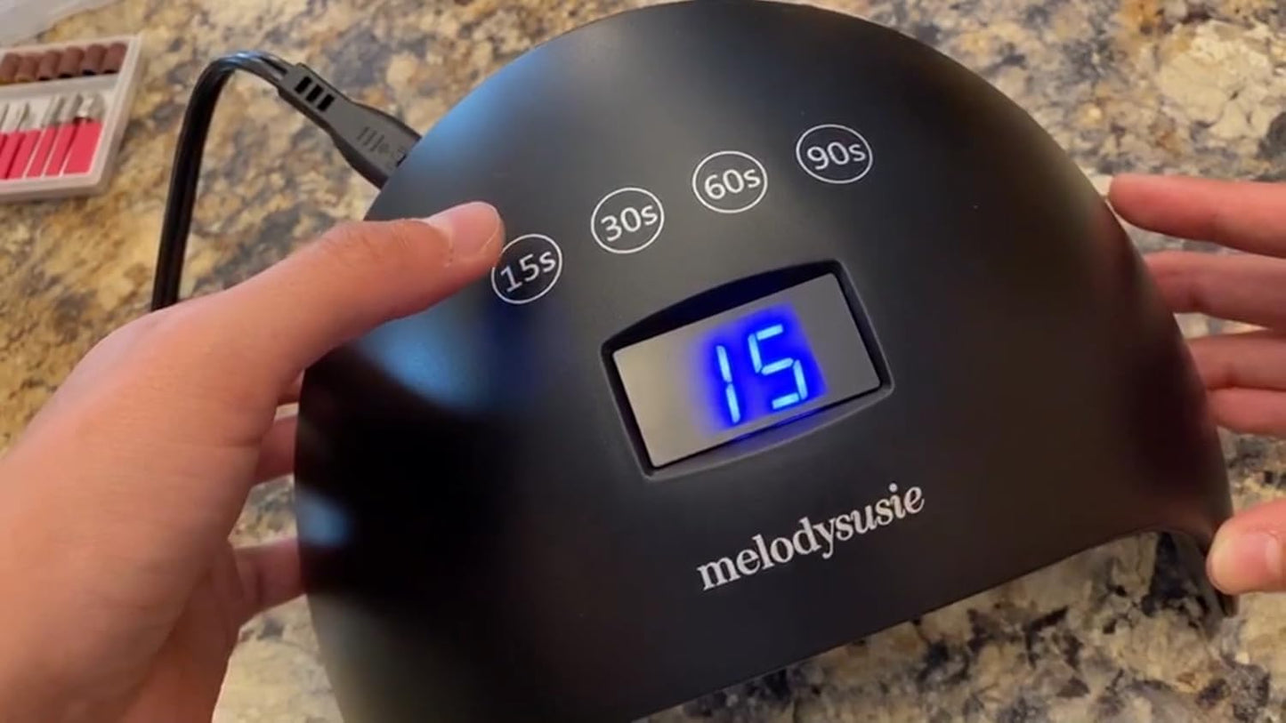 Packaging and contents of MelodySusie 48W LED UV nail lamp