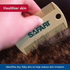 Hand holding Coastal Pet Safari flea comb demonstrating ergonomic grip